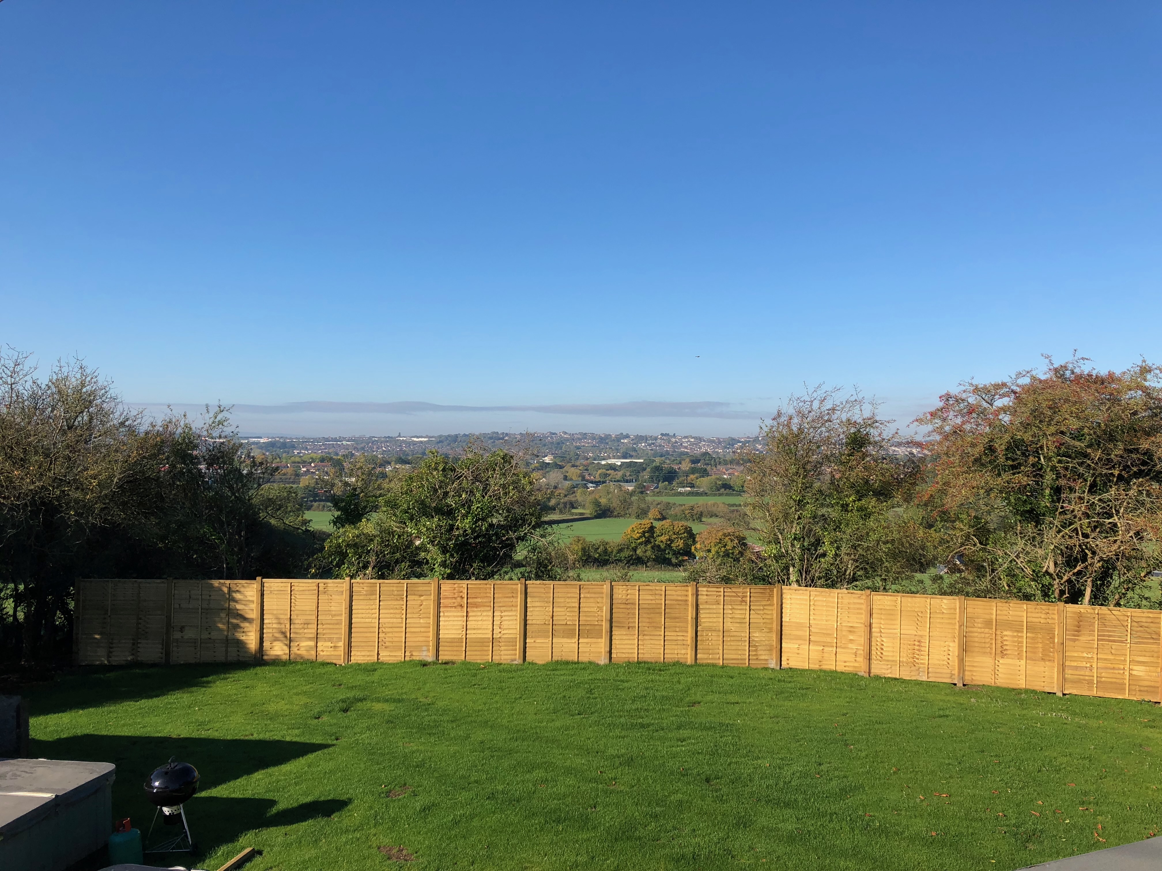 Overlap panel fencing with 4x4 wooden posts