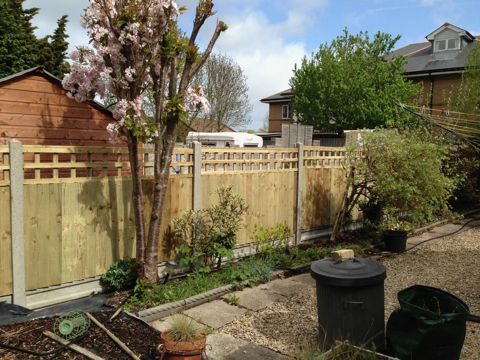 Trellis top closeboard panels with concrete posts
