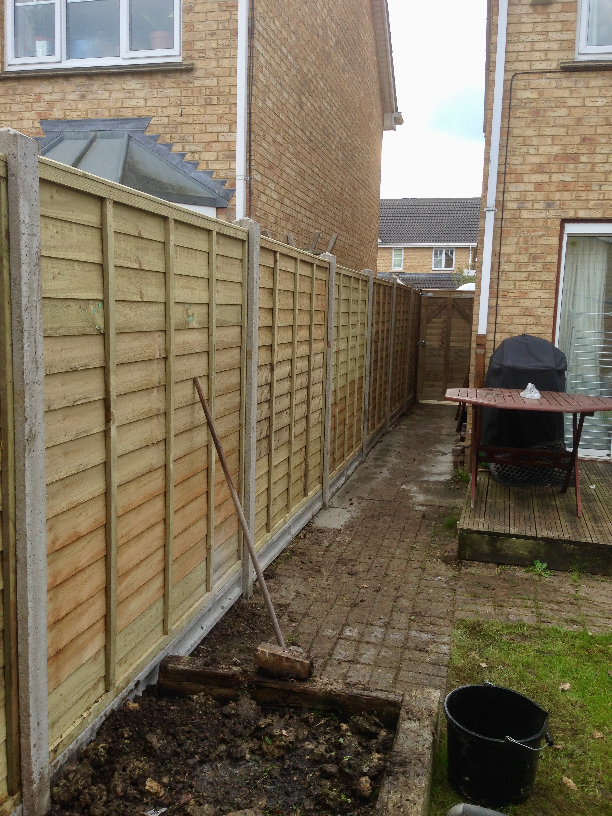 Overlap fence panels with concrete posts