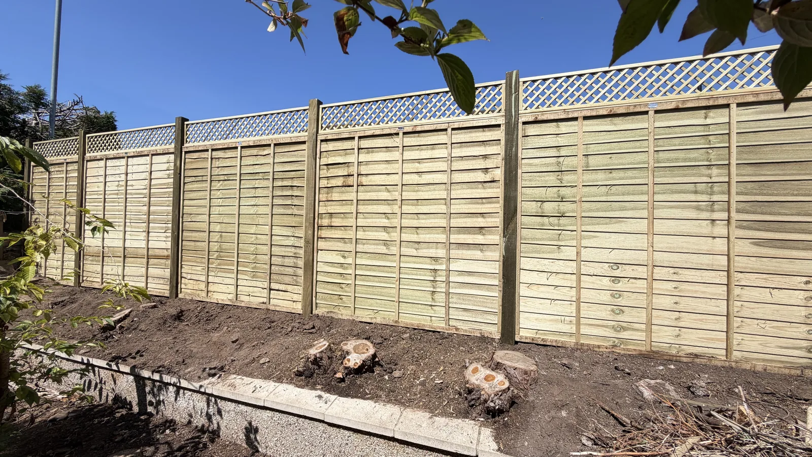 Bristol fencing project - 6ft high overlap fence panels with 4x4 timber posts, topped with a 1ft diamond trellis.