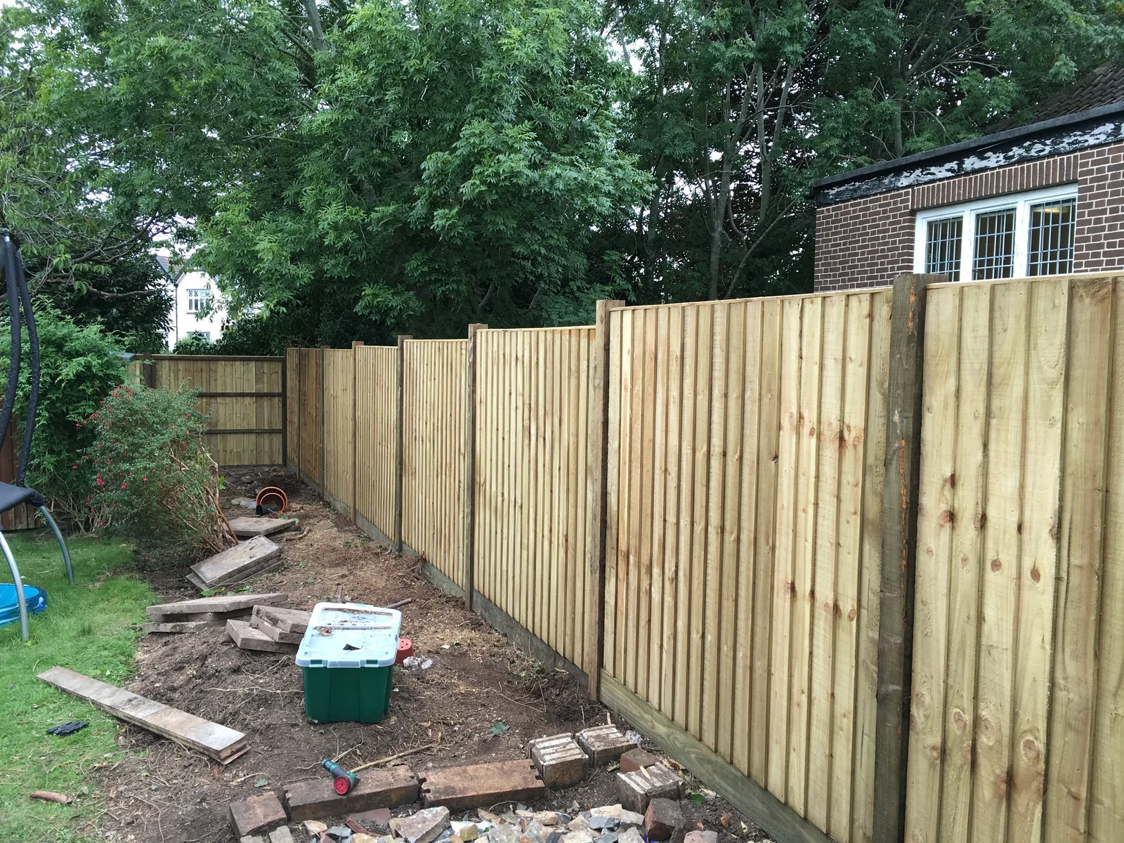 Closeboard panel fence with 4x4 wooden posts