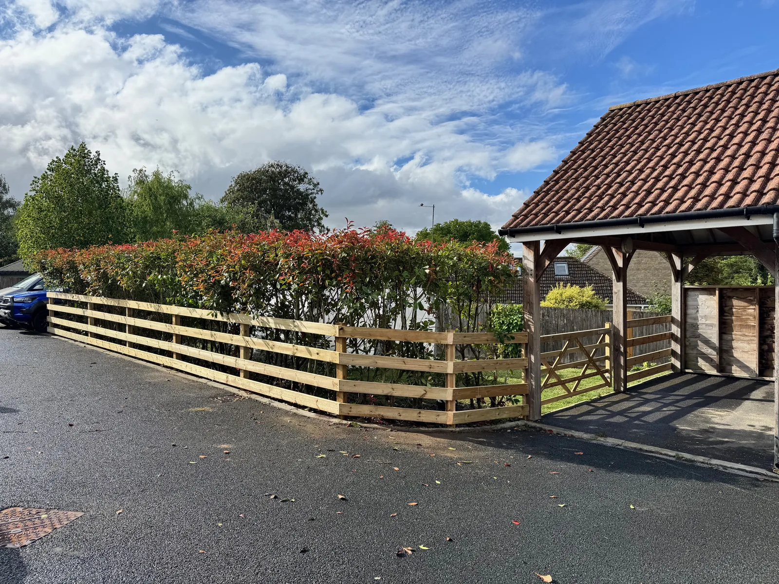 Post and rail fence with farm gate